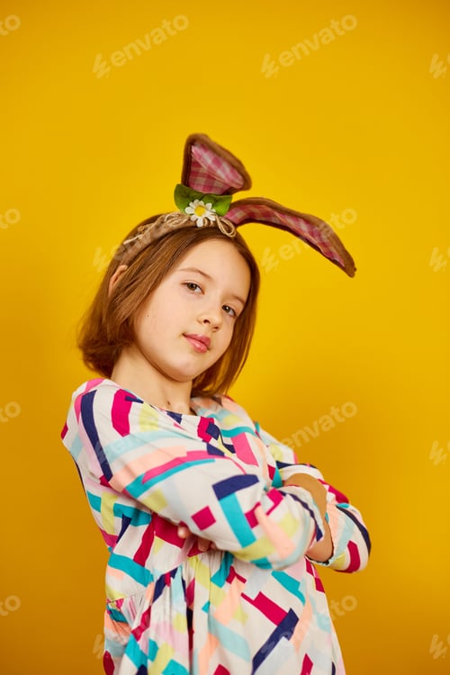 Preview: Girl Wearing Easter Bunny Ears on Yellow Background