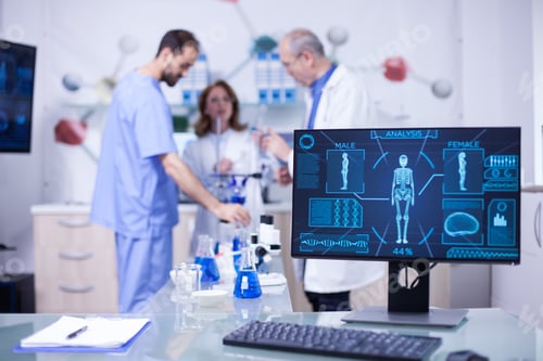 Scientists Working in Modern Research Laboratory Analyzing Data