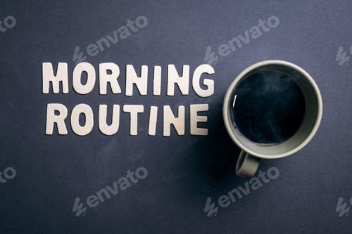 Preview: Morning Routine Concept with Steaming Coffee Cup and Wooden Letters on Dark Background for Health...
