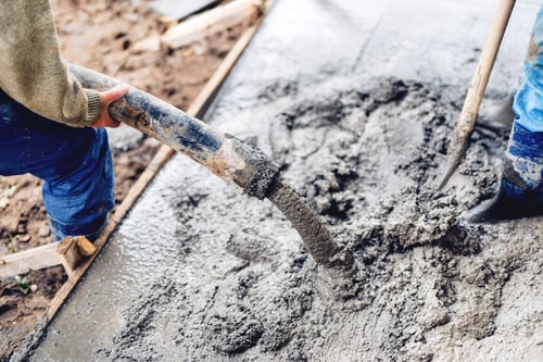 Preview: industrial construction workers using automatic pump tube for pouring cement on reinforcement bars