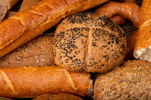 Preview: close-up view of poppy seed cob with baguette and other breads