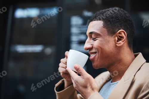 Preview: Pleased male person enjoying favorite smell of coffee