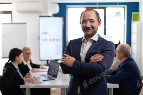 Preview: Young man entrepreneur smiling in front of camera standing in brainstorming room