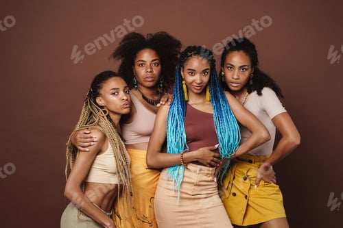 Preview: Young black four women hugging and posing at camera