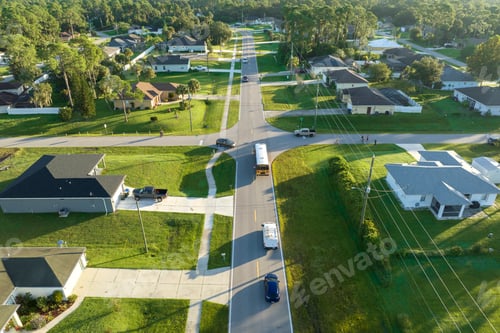 Preview: Top view of standard American yellow school bus picking up kids