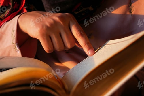 Preview: Muslim women's hand reading quran at night