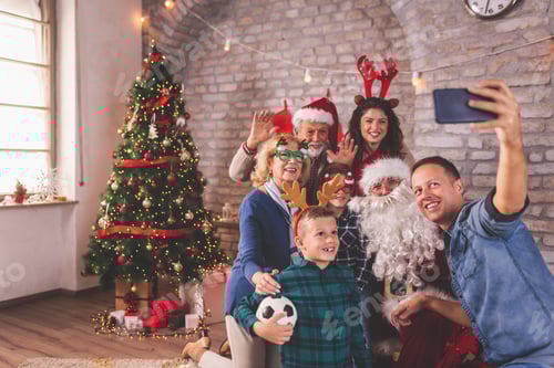 Preview: Family taking a selfie with Santa Claus