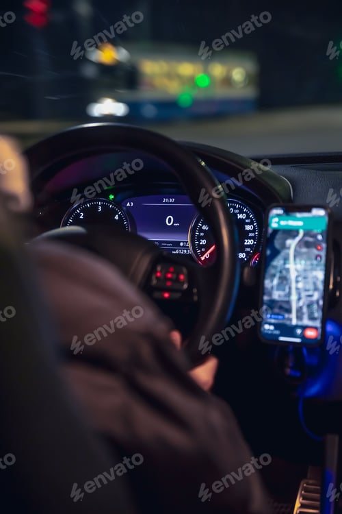 Preview: Driving a car at night, a woman driving her modern car at night in the city.