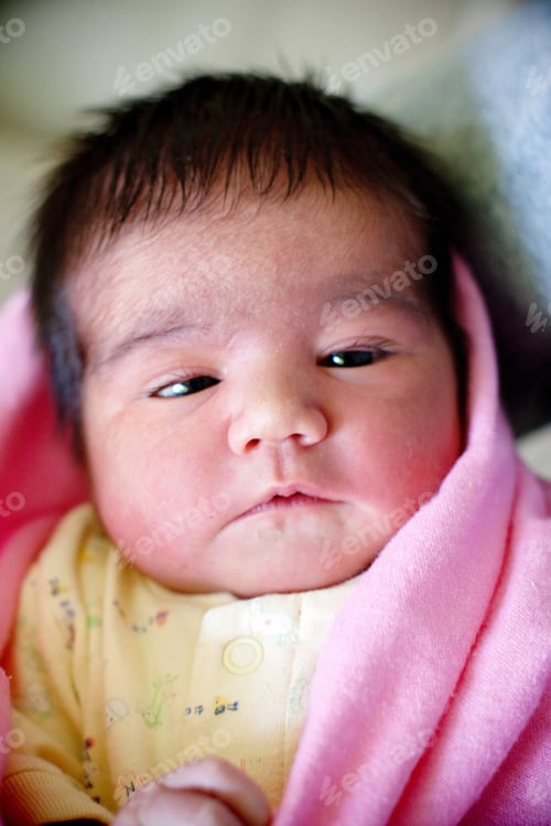 Preview: Newborn baby girl with dark hair