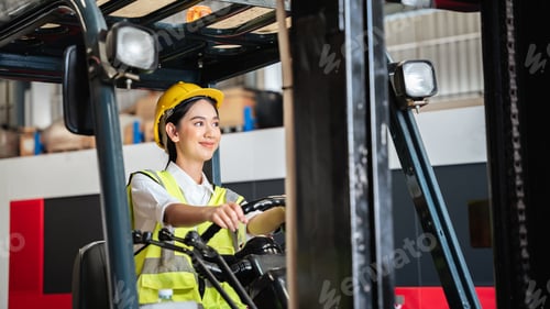 Preview: Warehouse worker working with a forklift in a warehouse or storehouse.