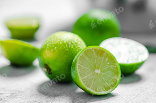 Preview: Fresh limes. On white table.