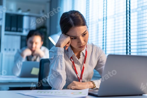 Preview: Exhausted Asian sick business woman feel tired and headache from late of work at night.