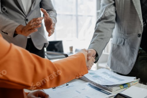 Preview: Meeting commitments in a meeting room at the office, Business people shaking hands in office, Shot o