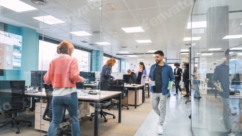 Preview: Diverse colleagues entering creative workspace