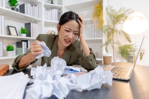 Preview: Stressed businesswoman dealing with heavy work pressure