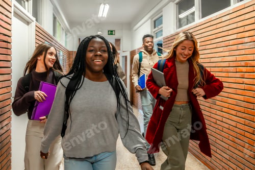 Preview: Happy university students walking in corridor at school institute