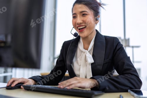 Preview: Operator agent with headsets working in a call center giving help as a customer service officer