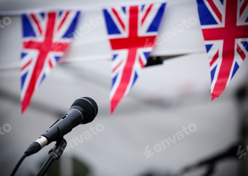 Preview: Microphone and union jack bunting at one of the concert stands at Garth Park, Bicester