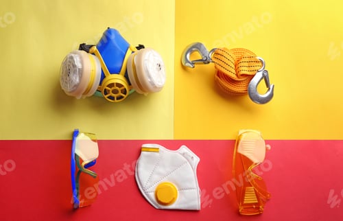 Preview: Flat lay composition with safety equipment on color background