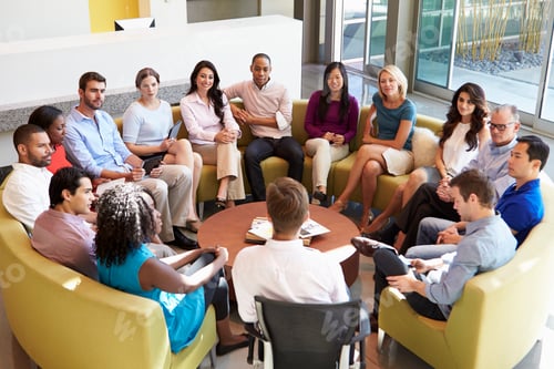 Preview: Multi-Cultural Office Staff Sitting Having Meeting Together
