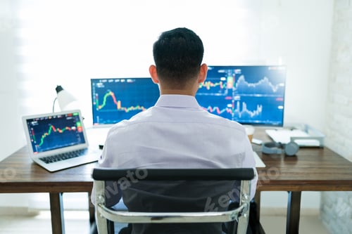 Preview: Freelance Online Trader Working At Desk