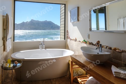 Preview: bathtub looking out over the ocean of Cape Town South Africa during vacation. Bath Tub during sunset