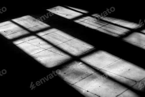 Preview: Bright sunlight entering an open broken window of a deserted room