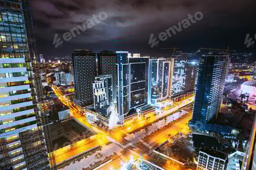 Preview: Street Night City Traffic and highrise houses . Elevated View Cityscape Skyline. Night Light