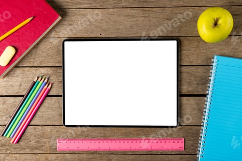 Preview: Composition of tablet with copy space and school equipment on wooden surface