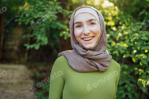 Preview: Beautiful joyful teen high school girl wearing colorful muslim clothing