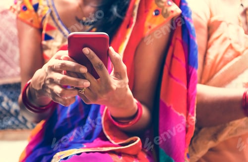Preview: Indian woman using mobile phone