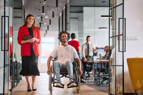 Preview: A business leader with her colleague, an African-American businessman who is a disabled person, pass
