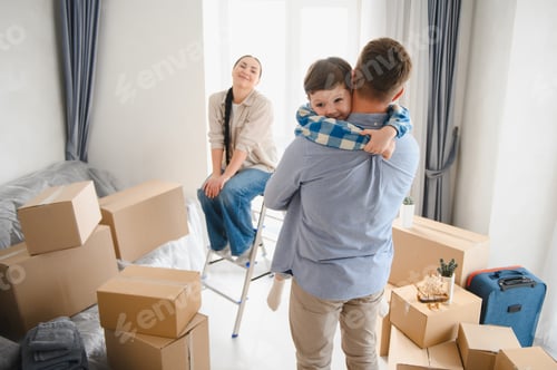 Preview: Family moving to new home embracing in room