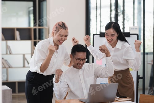 Preview: Happy business colleagues celebrating successful business year in the office room.