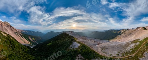 Preview: Panoramic View of Mountain Ridges Under Dramatic Skies in BC, Canada
