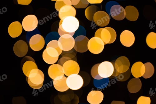 Preview: blurred golden lights over dark background