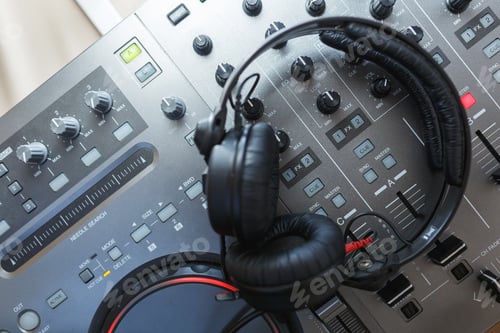 Preview: DJ Mixer with headphones.