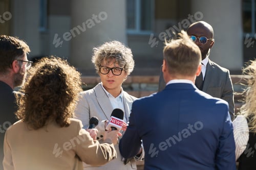 Preview: Caucasian Young Adult Woman Answering Questions during Outdoor Press Interview
