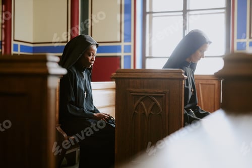Preview: Two Christian Nuns Praying In Church