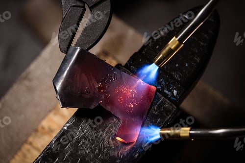 Preview: Top view of a piece of metal being melted in the workshop