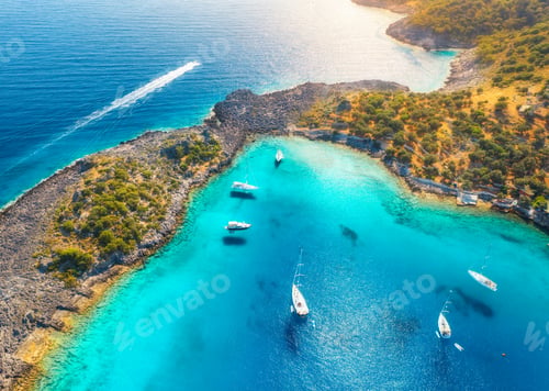 Preview: Aerial view of beautiful yachts and boats on the sea at sunset