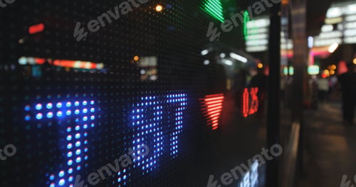 Preview: Display screen showing stock market prices at night