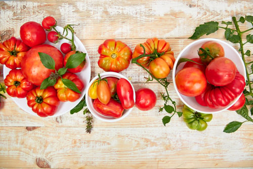 Preview: Colorful Heirloom Tomatoes in Bowls on Rustic Table