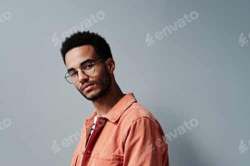 Preview: Man with Glasses Wearing an Orange Shirt