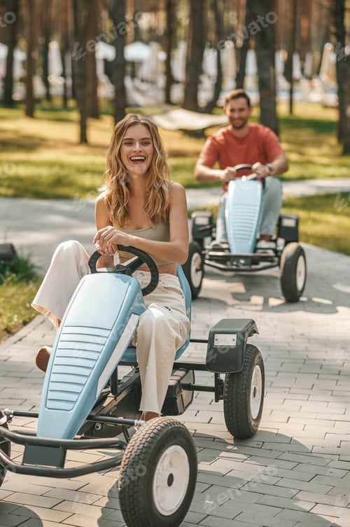 Preview: A young couple having a riding competion and looking enjoyed