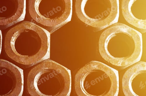 Preview: Closeup of a pile of rusty nuts. Retro industrial concept