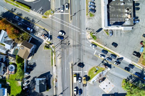 Preview: During rush hour, an aerial view of urban transportation intersection shows cars moving in heavy