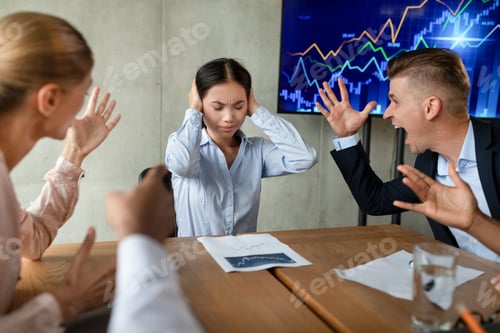 Preview: Workplace Bullying. Aggressive Coleagues Shouting At Stressed Asian Female Employee In Office