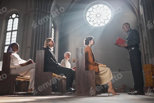 Preview: Priest reading the Bible