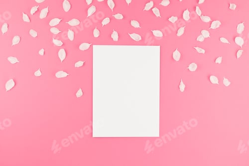 Preview: Flat lay of white postcard mock up with petals